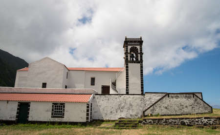 Traditional portuguese church in scenic green landscape on Azores islandの写真素材