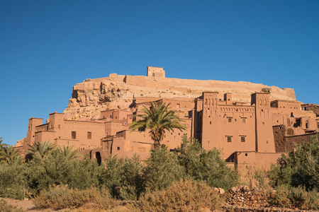 Old traditional desert kasbah village in Moroccan rock desertの写真素材