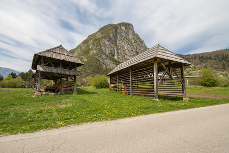 Traditional wooden double hayrack in small village of Studor near Bohinj in Slovenia during spring timeの写真素材