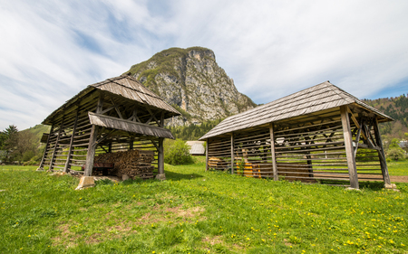 Traditional wooden double hayrack in small village of Studor near Bohinj in Slovenia during spring timeの写真素材