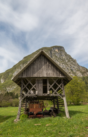 Traditional wooden double hayrack in small village of Studor near Bohinj in Slovenia during spring timeの写真素材