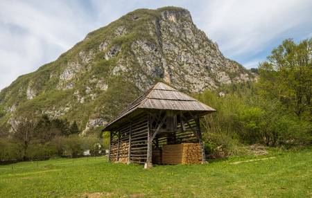 Traditional wooden double hayrack in small village of Studor near Bohinj in Slovenia during spring timeの写真素材