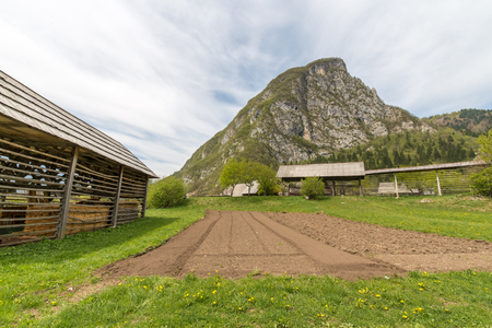 Traditional old wooden double hayrack in small village Studor near Bohinj in Sloveniaの写真素材