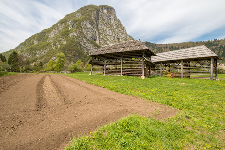 Traditional old wooden double hayrack in small village Studor near Bohinj in Sloveniaの写真素材