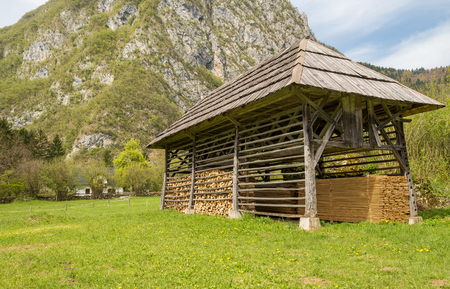 Traditional old wooden double hayrack in small village Studor near Bohinj in Sloveniaの写真素材