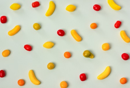 Variety of colorful candy pattern on pastel background.の写真素材