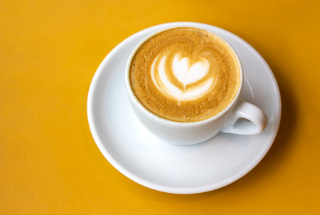 White cup of cappuccino with latte art.の写真素材