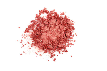 Smashed coral eyeshadow isolated on a white background. Trendy color concept of the year 2019.の写真素材