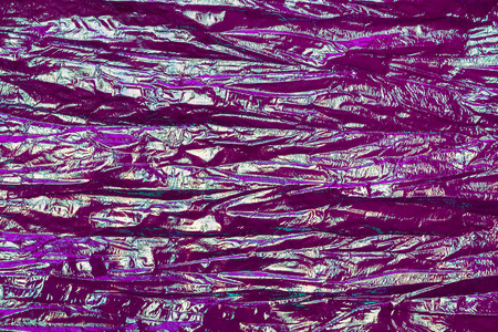 Holographic abstract neon textured background. Retro wave neon colors.の写真素材