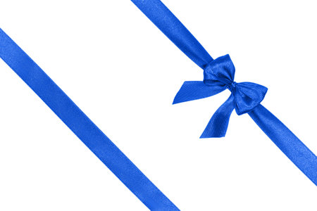 Blue satin ribbon with a bow isolated on white background. Decoration concept.の写真素材