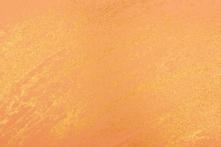 Abstract light orange background with golden glitter. Holiday decoration concept. Place for text.の写真素材