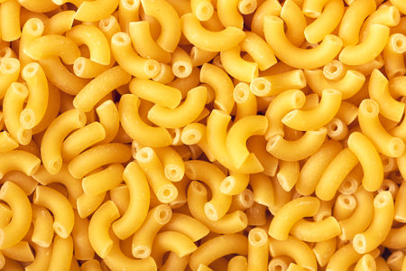Dry macaroni pasta backround. Close up view.の写真素材