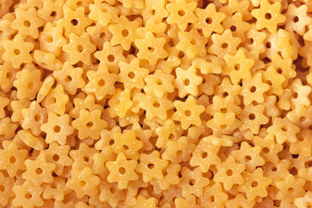 Dry star shaped pasta backround. Close up view.の写真素材