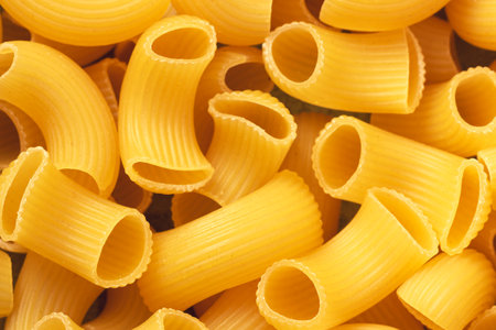 Dry pipe rigati pasta backround. Closeup view.の写真素材