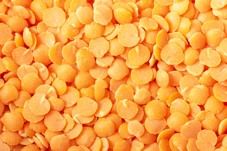 Red lentil background. Abstract food texture. Close up view.の写真素材