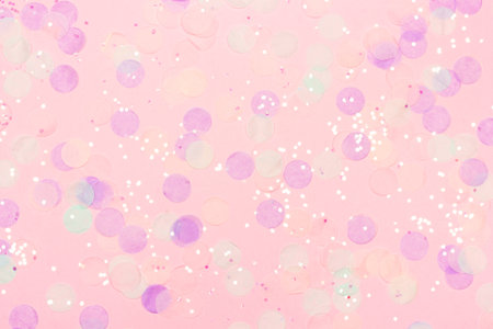 Beautiful pastel pink festive background with confetti. Top view. Copy space for text.の写真素材