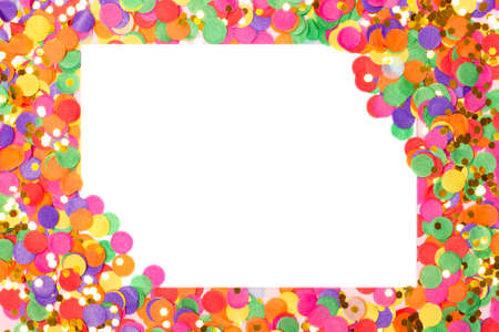 Festive background with blank white paper card on colorful confetti. Holiday or Invitation concept. Place for text. Flat lay, view from above.の写真素材