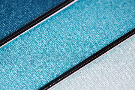 Close up of a palette of eyeshadows in blue tones.の写真素材