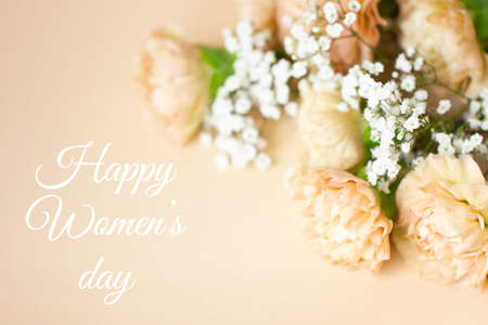 Beige carnation flowers bouquet on light beige background.の写真素材