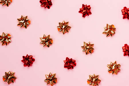 Festive pastel pink background with glossy starbows.の写真素材