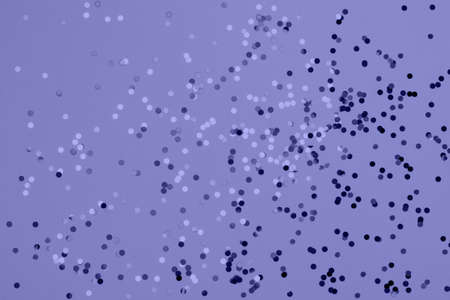 Festive pastel peri background with metallic confetti.の写真素材