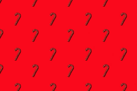 Christmas holiday pattern. Red canes on red background.の写真素材
