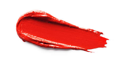 Red smudged lipstick isolated on white background.の写真素材