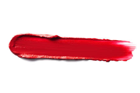 Red smudged lipstick isolated on white background.の写真素材