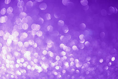 Festive abstract blurred glitter background purple color.の写真素材