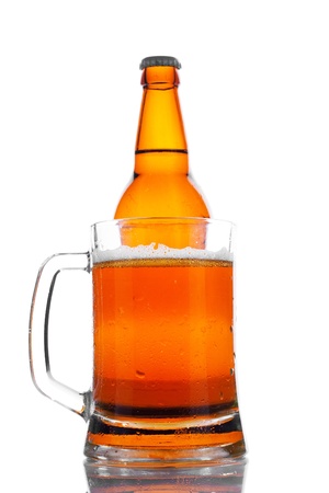 glass and bottle of beer with reflectionの写真素材