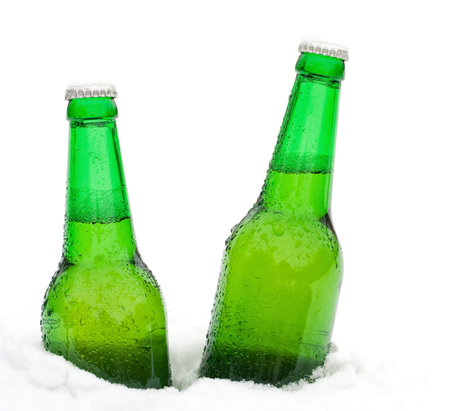 beer bottles in snowの写真素材