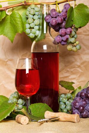 wine with red and white bunch of grapes on sackingの写真素材