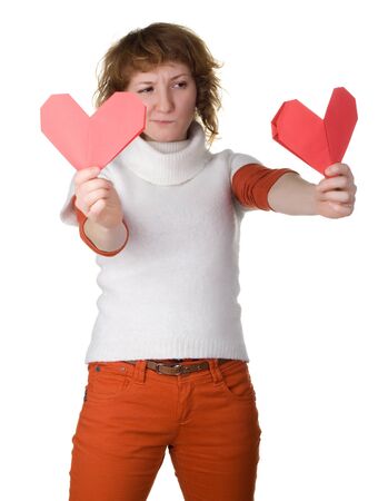 girl holding 2 origami hearts makes choiseの写真素材