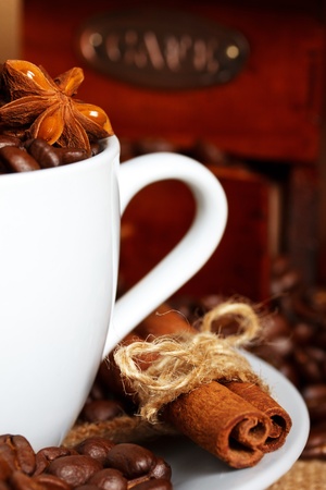 coffee and spices with grinder on backgroundの写真素材