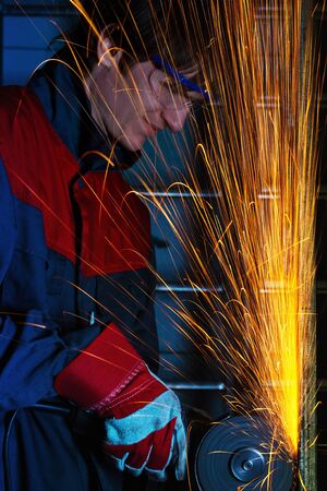 worker grinding ironの写真素材