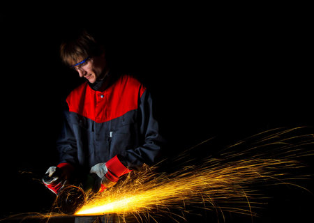 worker grinding iron