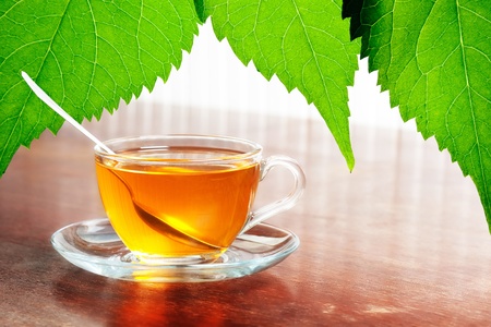 cup of aromatic tea on wooden tableの写真素材