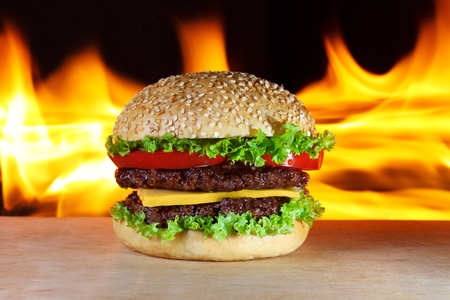 big hamburger with real fire on a backgroundの写真素材