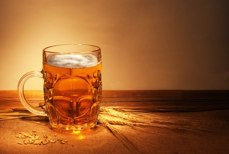 beer on sacking with wheat still-lifeの写真素材