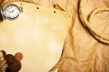 blank aged paper with antique watch and moneyの写真素材