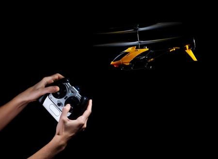 Piloting remote control helicopterの写真素材