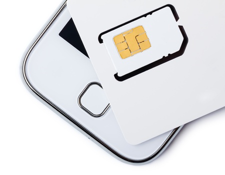 Blank sim card with smart phone isolated on whiteの写真素材