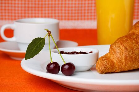 Breakfast with croissant, coffee and juiceの写真素材