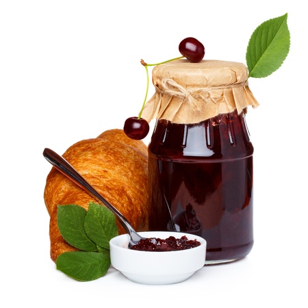 Cherry jam with croissants and juice isolatedの写真素材