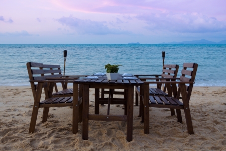 Beach dinner serving at sunsetの写真素材
