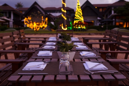 Evening beach dinner serving in sunset lightの写真素材
