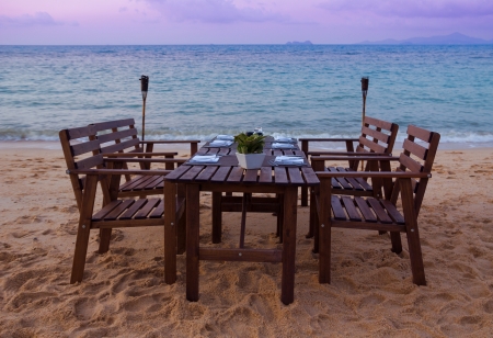 Beach dinner serving at sunsetの写真素材