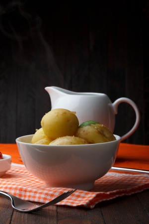 Prepared hot potato on wooden tableの写真素材