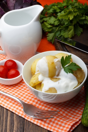 Boiled potatoes with parsley and sour creamの写真素材