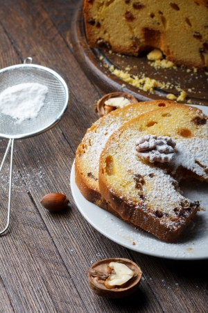 Fruitcake with nuts, raisin and sugar powderの写真素材